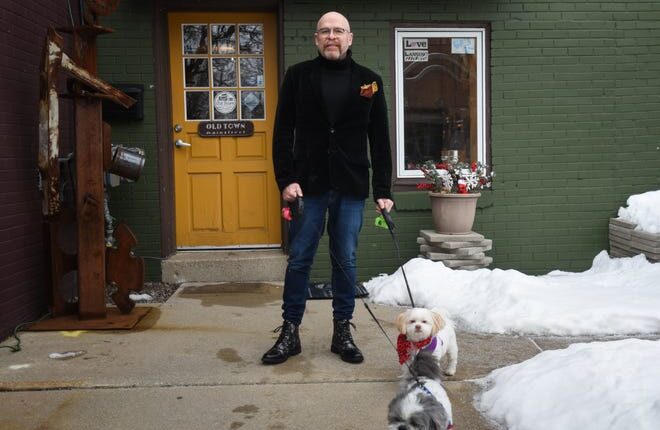 Owosso resident Robert Doran-Brockway pictured with his two dogs Gizmo and Joey.  He began his new role as Old Town Commercial Association executive director Jan 3.