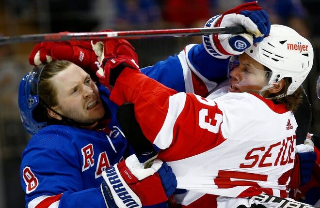 New York Rangers' Jacob Trouba (8) and Detroit Red Wings' Moritz Seider (53) scuffle during the first period at Madison Square Garden in New York on Thursday, Feb. 17, 2022.