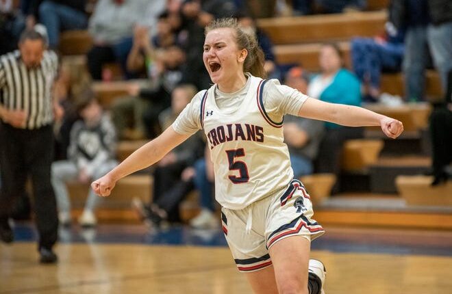 East Lansing sophomore Sophie Klinger (5) celebrates winning the Division 1 regional semifinal against Parma Western at Mattawan High School on Tuesday, March 8, 2022. 