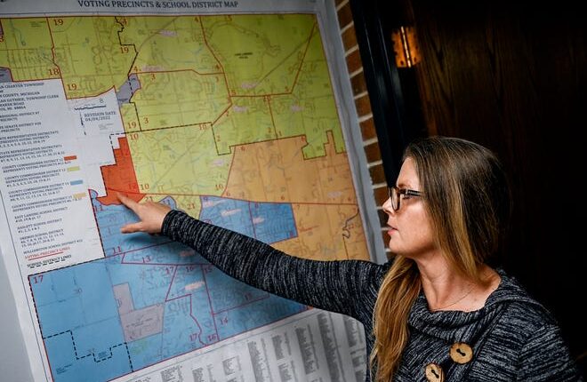 Meridian Township Clerk Deborah Guthrie talks about the new Ingham County Commission districts on Wednesday, July 20, 2022, at the Meridian Township Municipal Building in Okemos.  The township has also changed some of its polling locations.