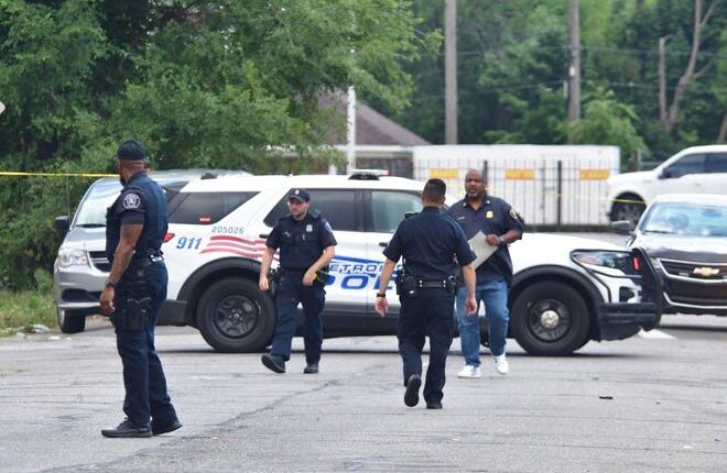 Detroit police investigators at the scene of a shooting on Saratoga Street near Gratiot Avenue in Detroit on Saturday, August 6, 2022.