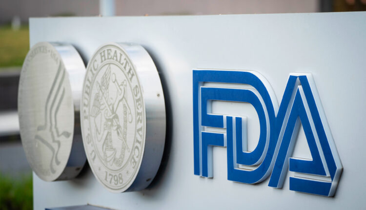 A photo shows a sign outside the FDA's headquarters.