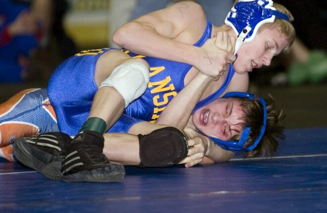 Lansing's Kyle Dake, left, wrestles Thomas Edison's Matt Gublo in the Division II 112 pound weight class in 2007 at Broome County Veterans Memorial Arena in Binghamton.