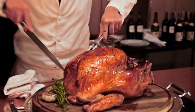 Chef carving Thanksgiving turkey