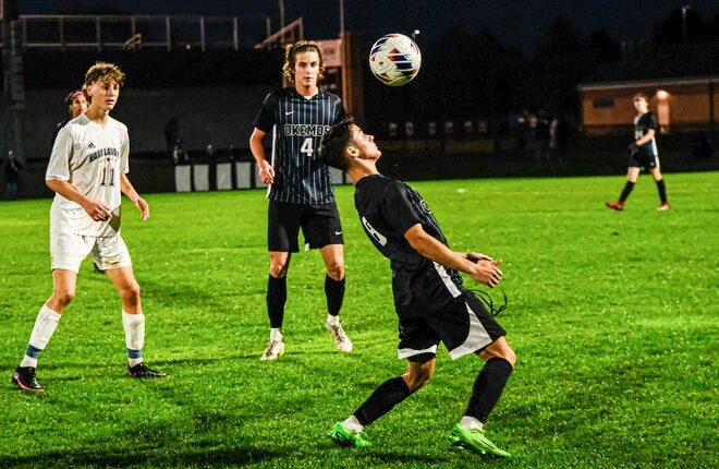 Leo Arana (8) from Okemos settles the ball against East Lansing in Gold Cup Final play Thursday, Oct.  6, 2022.